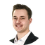 Photo of Przemysław Draga smiling. Photo of Przemysław Draga smiling.